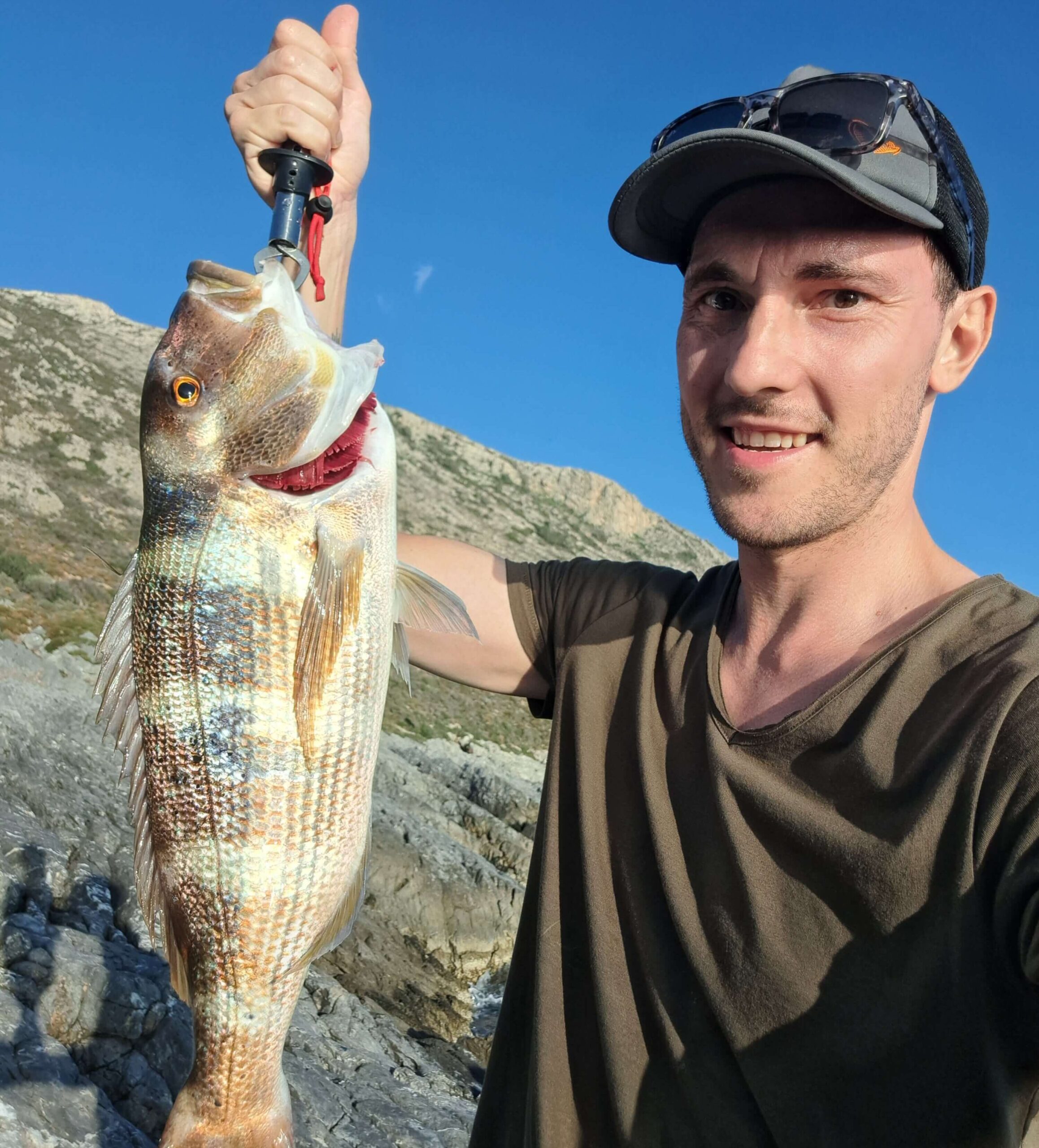 Kai with a Dentex in his hand