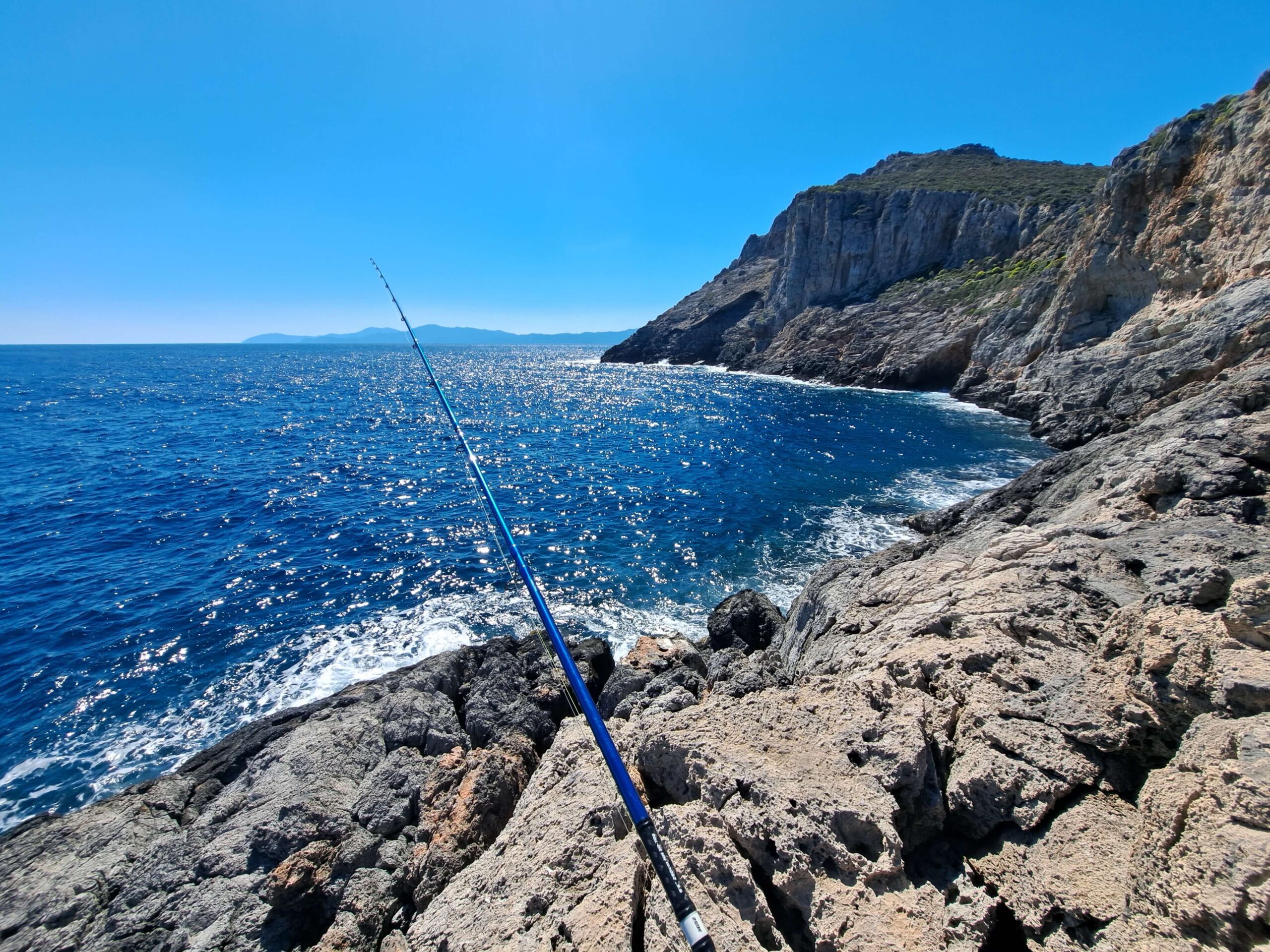 POV: Kai looking at the ocean with a rod in his hand